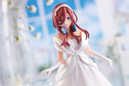 Miku Nakano figure in a classic white bridal dress, holding a bouquet, with a serene expression and a delicate pose.